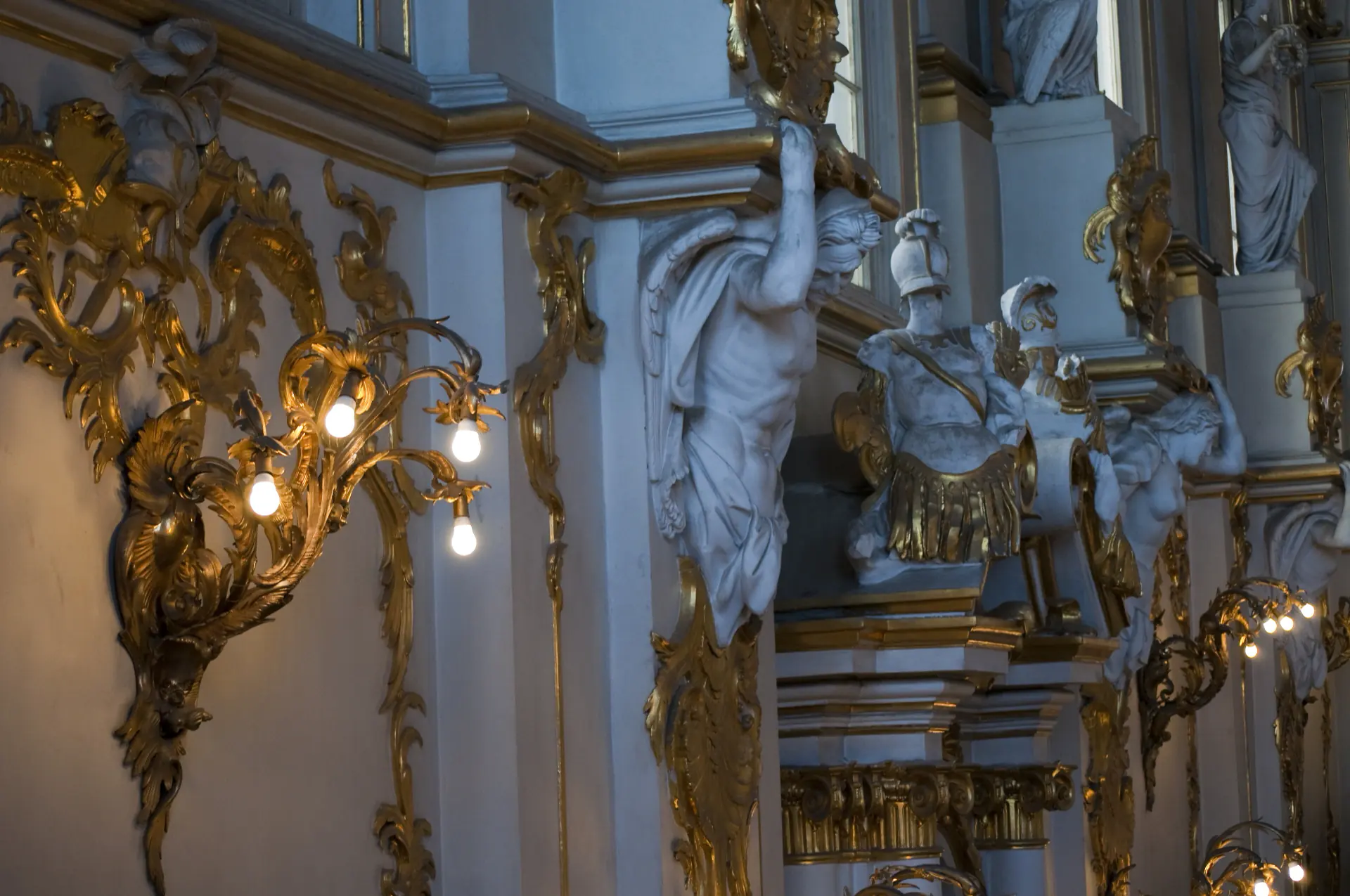 Gilded stucco and a chandelier in a state room of the Hermitage.