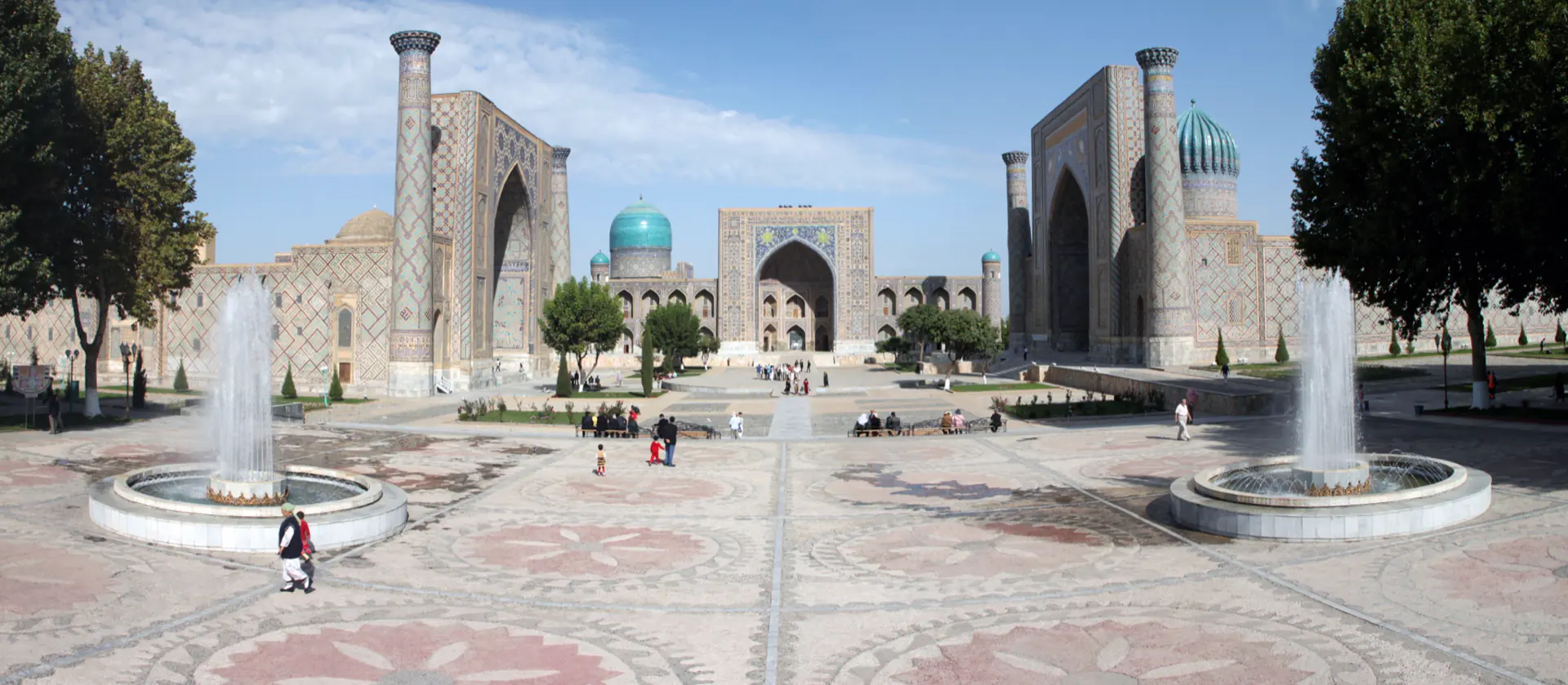 The three madrasas of the Registan in Samarkand, tiled façades facing a common square.