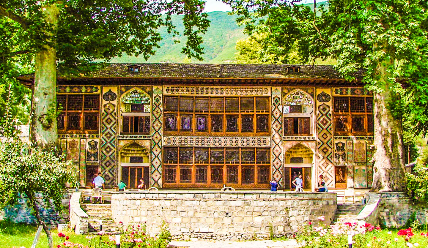 The painted main façade of the Sheki Khan’s Palace and its shebeke windows.