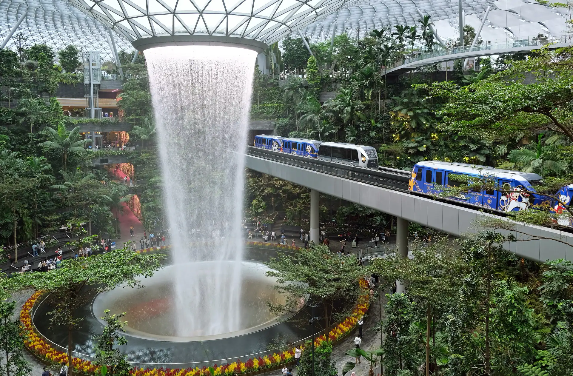 The Rain Vortex falling through the centre of Jewel Changi Airport.