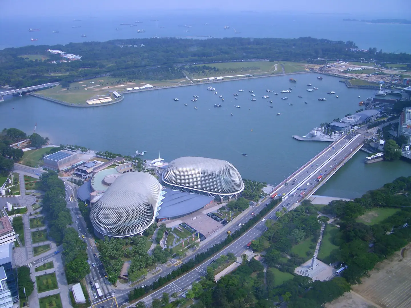 Marina Bay from the air, the ArtScience Museum and the bay front below.