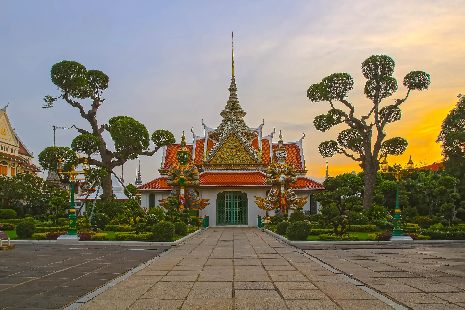 The porcelain-encrusted prang of Wat Arun on the Chao Phraya before sunset.