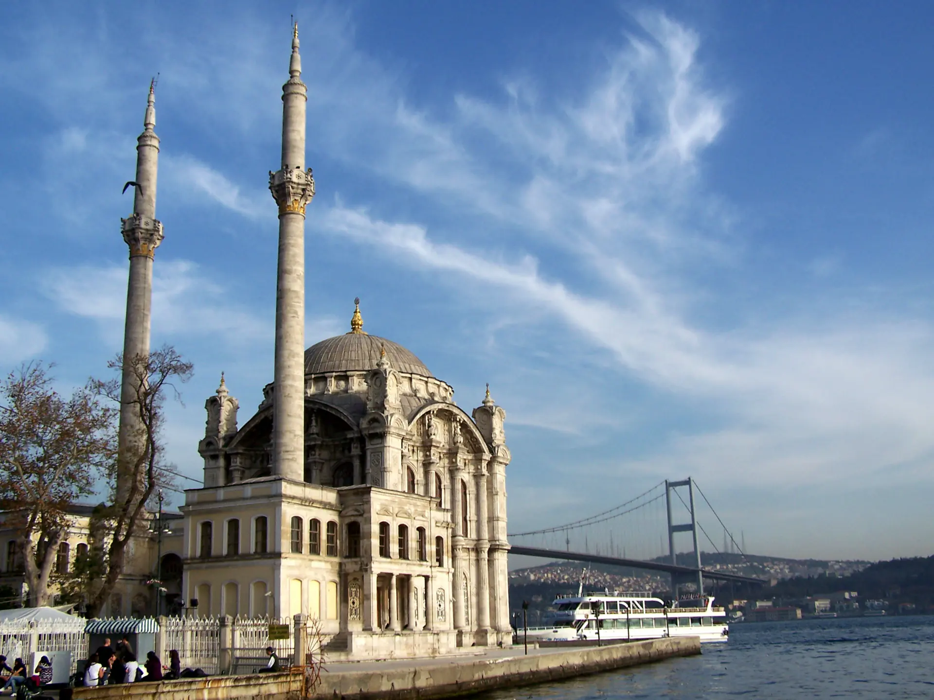 Ortaköy Mosque on the Bosphorus shore with the bridge behind it.